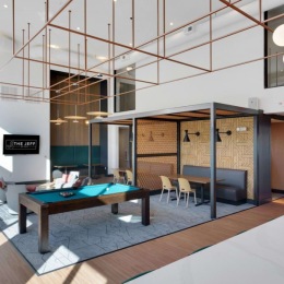 Social lounge and billiards area at The Jeff on 10th apartments