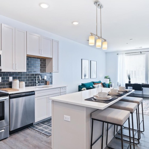 a kitchen with white cabinets