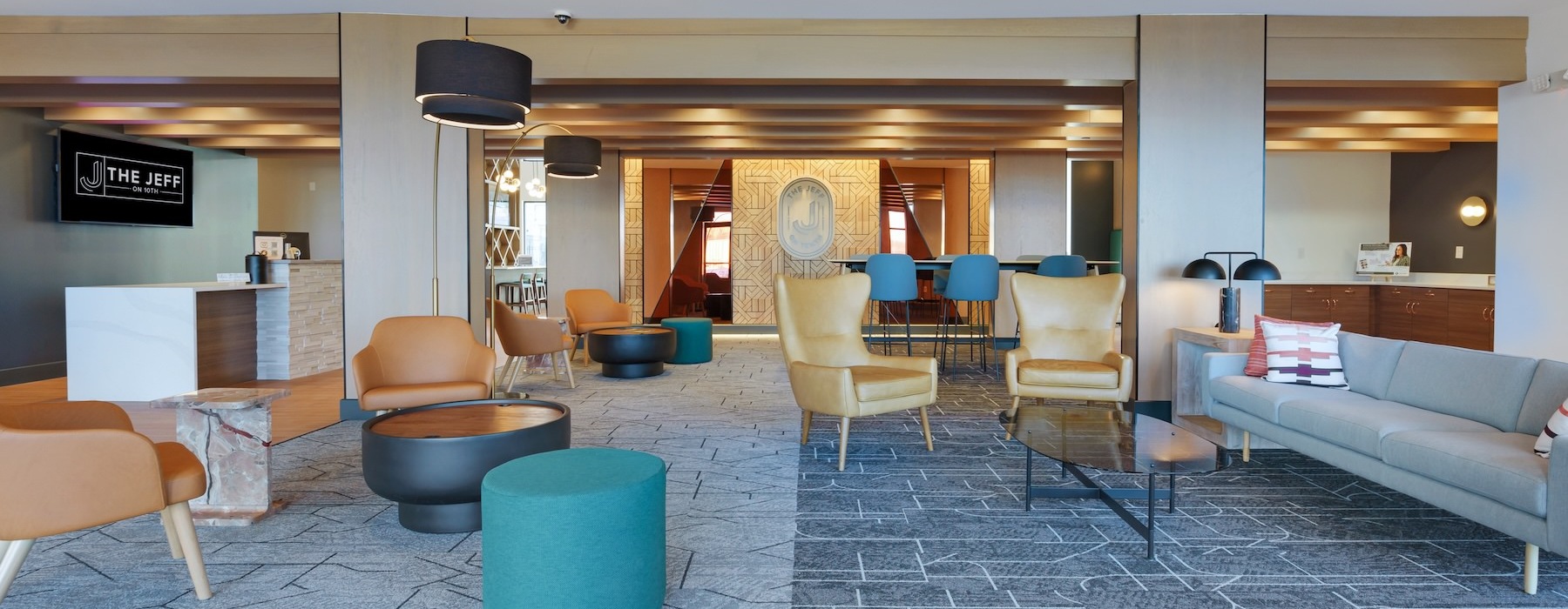 a clubroom with a couch and chairs
