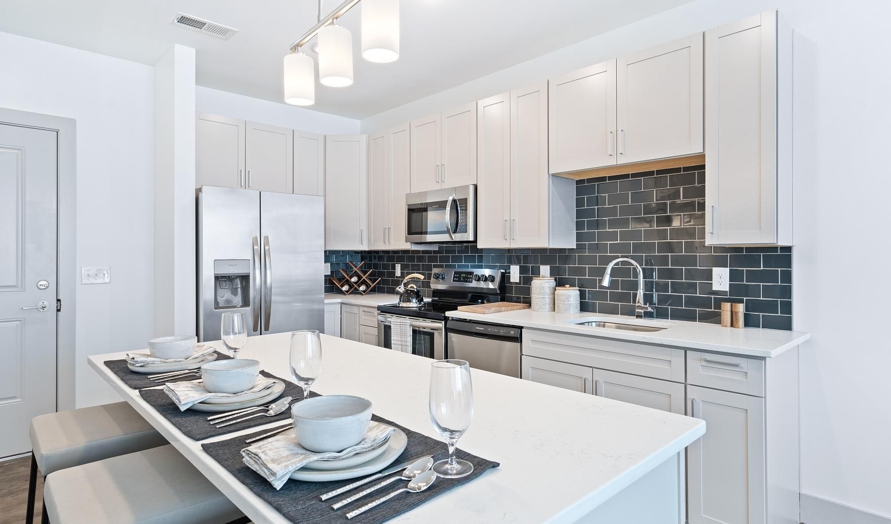 a kitchen with white cabinets